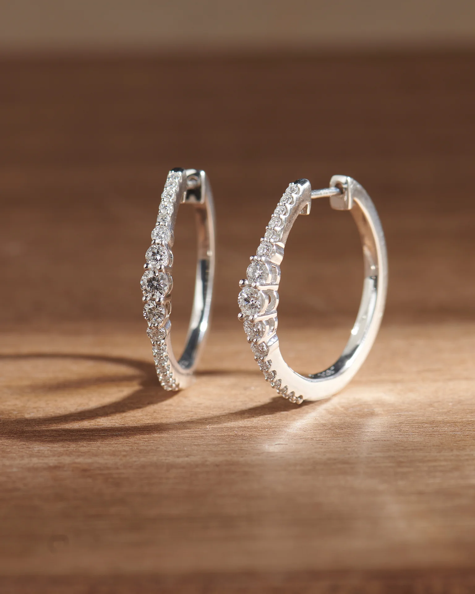 Round Graduated Solitaire Earrings - Image 5